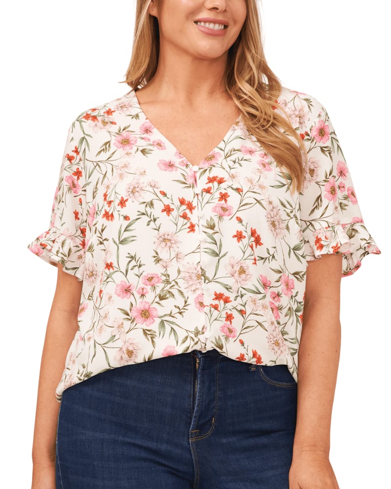 Front of a model wearing a size 0X Anika Button Loop Frill Sleeve Top in BOTANICALDREAMSE by CeCe. | dia_product_style_image_id:263325
